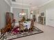 Elegant dining room featuring a chandelier, china cabinets, and a decorative rug at 615 May Apple Way, Venice, FL 34293