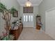 Grand foyer with high ceilings, decorative tile flooring, and elegant furnishings at 615 May Apple Way, Venice, FL 34293