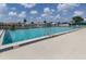 A large community pool with clear water, ladder access and seven foot depth mark for refreshing recreation at 615 May Apple Way, Venice, FL 34293