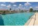 A large community pool with clear water, ladder access and seven foot depth mark for refreshing recreation at 615 May Apple Way, Venice, FL 34293