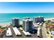 Beautiful aerial view of beachfront condos with a white sandy beach and ocean views at 627 Alhambra Rd # 1103, Venice, FL 34285