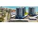 Stunning aerial view of beachfront condos with covered parking and lush landscaping at 627 Alhambra Rd # 1103, Venice, FL 34285