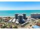 Stunning aerial view of beachfront condos with turquoise waters and parking at 627 Alhambra Rd # 1103, Venice, FL 34285