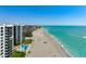 Beautiful beach and beachfront condo with a swimming pool, green lawns and stunning views of the Gulf at 627 Alhambra Rd # 1103, Venice, FL 34285