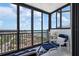 Bright Sunroom with ocean views, comfortable seating, and access to fresh air at 627 Alhambra Rd # 1103, Venice, FL 34285