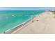 Beautiful beach with turquoise water and people enjoying the sunshine near a beachfront condo complex at 627 Alhambra Rd # 1103, Venice, FL 34285