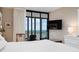 Bedroom featuring a window and ocean view, complemented by modern furnishings at 627 Alhambra Rd # 1103, Venice, FL 34285