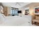 Bedroom with white furniture, art decor and balcony access, and ocean view at 627 Alhambra Rd # 1103, Venice, FL 34285