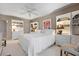 Spacious bedroom with built-in bookshelves and a large window, decorated with white furniture at 627 Alhambra Rd # 1103, Venice, FL 34285