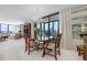 Elegant dining room featuring a crystal chandelier and floor to ceiling windows at 627 Alhambra Rd # 1103, Venice, FL 34285