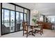 Beautiful dining room with ocean views, chandelier, and bar area at 627 Alhambra Rd # 1103, Venice, FL 34285
