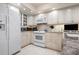 Bright kitchen with white cabinetry and appliances at 627 Alhambra Rd # 1103, Venice, FL 34285