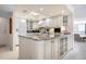 Kitchen island with seating open to the living room at 627 Alhambra Rd # 1103, Venice, FL 34285