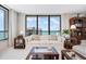 Serene living room boasts ocean views, comfortable seating, and stylish furnishings at 627 Alhambra Rd # 1103, Venice, FL 34285