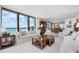 Bright living room with large windows offering stunning ocean views at 627 Alhambra Rd # 1103, Venice, FL 34285
