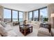 Comfortable living room featuring ocean views, neutral decor, and ample seating at 627 Alhambra Rd # 1103, Venice, FL 34285