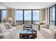 Bright living room with floor-to-ceiling windows offering breathtaking coastal views at 627 Alhambra Rd # 1103, Venice, FL 34285