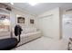 Office space with sofa and shelving, featuring an adjacent closet at 627 Alhambra Rd # 1103, Venice, FL 34285