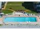 Beautiful swimming pool by the ocean with lounge chairs, tables, and community barbeque grills at 627 Alhambra Rd # 1103, Venice, FL 34285