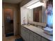 Bathroom boasts an extended vanity area and mirrored medicine cabinet above at 638 Leisure, Venice, FL 34285