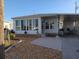 Charming home featuring a covered carport, manicured landscaping, and a welcoming entryway at 638 Leisure, Venice, FL 34285