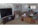 Warm living room with a comfortable sofa, large television, and plenty of space to relax at 638 Leisure, Venice, FL 34285