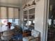 Sunroom is furnished with seating around a table and many windows at 638 Leisure, Venice, FL 34285