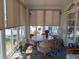 Sunroom showcases table seating with natural light streaming through the large windows at 638 Leisure, Venice, FL 34285