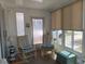 Sunroom features seating and sun-blocking shades at 638 Leisure, Venice, FL 34285
