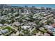 Aerial shot features a neighborhood with well-manicured lawns, pools, and nearby access to the beautiful coast at 701 Laguna Dr, Venice, FL 34285