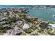 Stunning aerial view of waterfront homes with beautiful landscaping and nearby beach access at 701 Laguna Dr, Venice, FL 34285