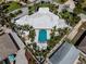 Aerial view of a luxury backyard pool with a surrounding patio and ample lounge space for relaxation at 701 Laguna Dr, Venice, FL 34285