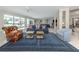 Spacious living room features comfortable seating, elegant decor, and access to outdoor pool area at 701 Laguna Dr, Venice, FL 34285
