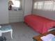 A comfortable bedroom offers a dresser and natural light at 722 Carefree, Venice, FL 34285