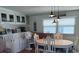 Dining area with stylish chairs, unique lighting and a window at 722 Carefree, Venice, FL 34285
