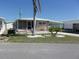 Charming single-story home with a screened porch, carport and rock garden at 722 Carefree, Venice, FL 34285