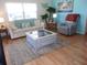 Inviting living room featuring sofa, artwork and a gray rug at 722 Carefree, Venice, FL 34285
