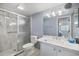 Updated bathroom featuring a glass-enclosed shower, modern vanity, and contemporary fixtures at 758 Bird Bay W Dr # 169, Venice, FL 34285