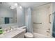 Clean bathroom with a tub and shower combination, marble vanity, and modern fixtures at 758 Bird Bay W Dr # 169, Venice, FL 34285