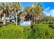 Venice Beach entrance sign surrounded by lush foliage, showcasing local attractions and nearby community at 758 Bird Bay W Dr # 169, Venice, FL 34285