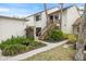 Condominium exterior with wooden stairs and well maintained landscaping at 758 Bird Bay W Dr # 169, Venice, FL 34285