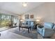 Comfortable living room featuring a ceiling fan and sliding glass doors to a patio at 758 Bird Bay W Dr # 169, Venice, FL 34285