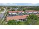 Well-maintained townhomes feature terra cotta roofs and convenient carport parking in a lush, landscaped community at 764 Avenida Estancia # 212, Venice, FL 34292