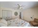 Bedroom with a ceiling fan, comfortable queen bed, and closet at 764 Avenida Estancia # 212, Venice, FL 34292