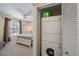 A laundry closet featuring stacked washer and dryer with easy access from bedroom at 764 Avenida Estancia # 212, Venice, FL 34292