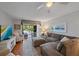Inviting living room with sliding glass doors leading to the lanai, offering peaceful views at 764 Avenida Estancia # 212, Venice, FL 34292