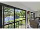 Private patio overlooking lush landscaping, serene pond, and water fountain features at 764 Avenida Estancia # 212, Venice, FL 34292