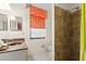 Well-lit bathroom featuring a shower, toilet, and vanity with a vessel sink at 888 Kimball Rd, Venice, FL 34293