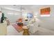 Comfortable living room featuring natural lighting, carpet floors, and casual decor at 888 Kimball Rd, Venice, FL 34293