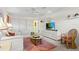 Relaxing living room featuring a ceiling fan, carpet floors, and a TV at 888 Kimball Rd, Venice, FL 34293